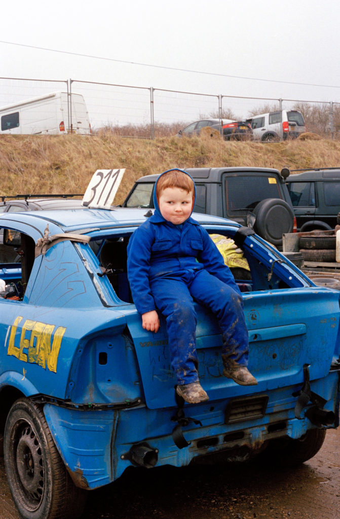 boy sat on blue banger car foxhall stadium