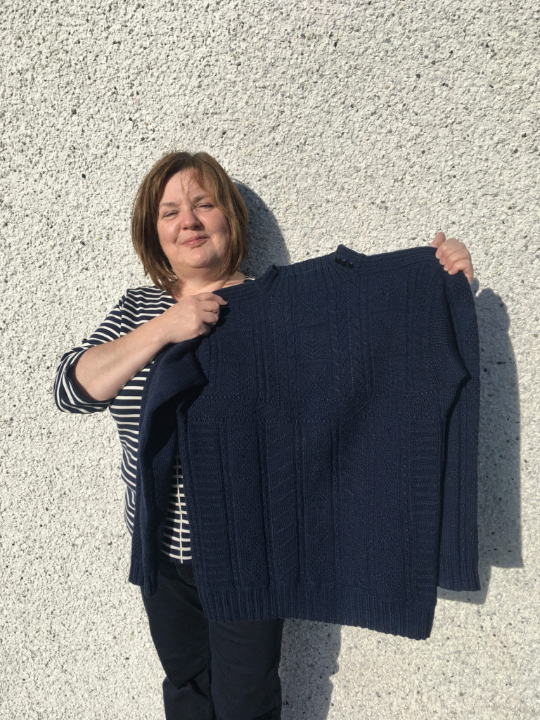 women holding eriskay jumper outer hebrides