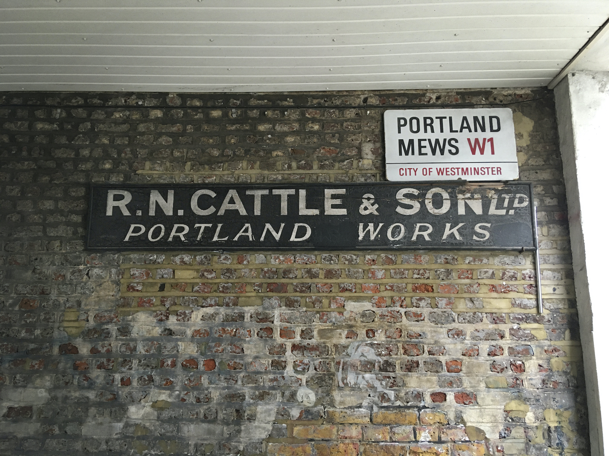 old carpenters sign cattle & son portland mews soho london