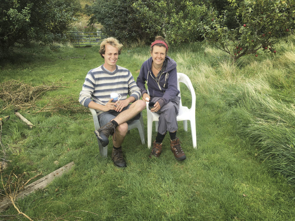 gardeners sitting on plastic chairs